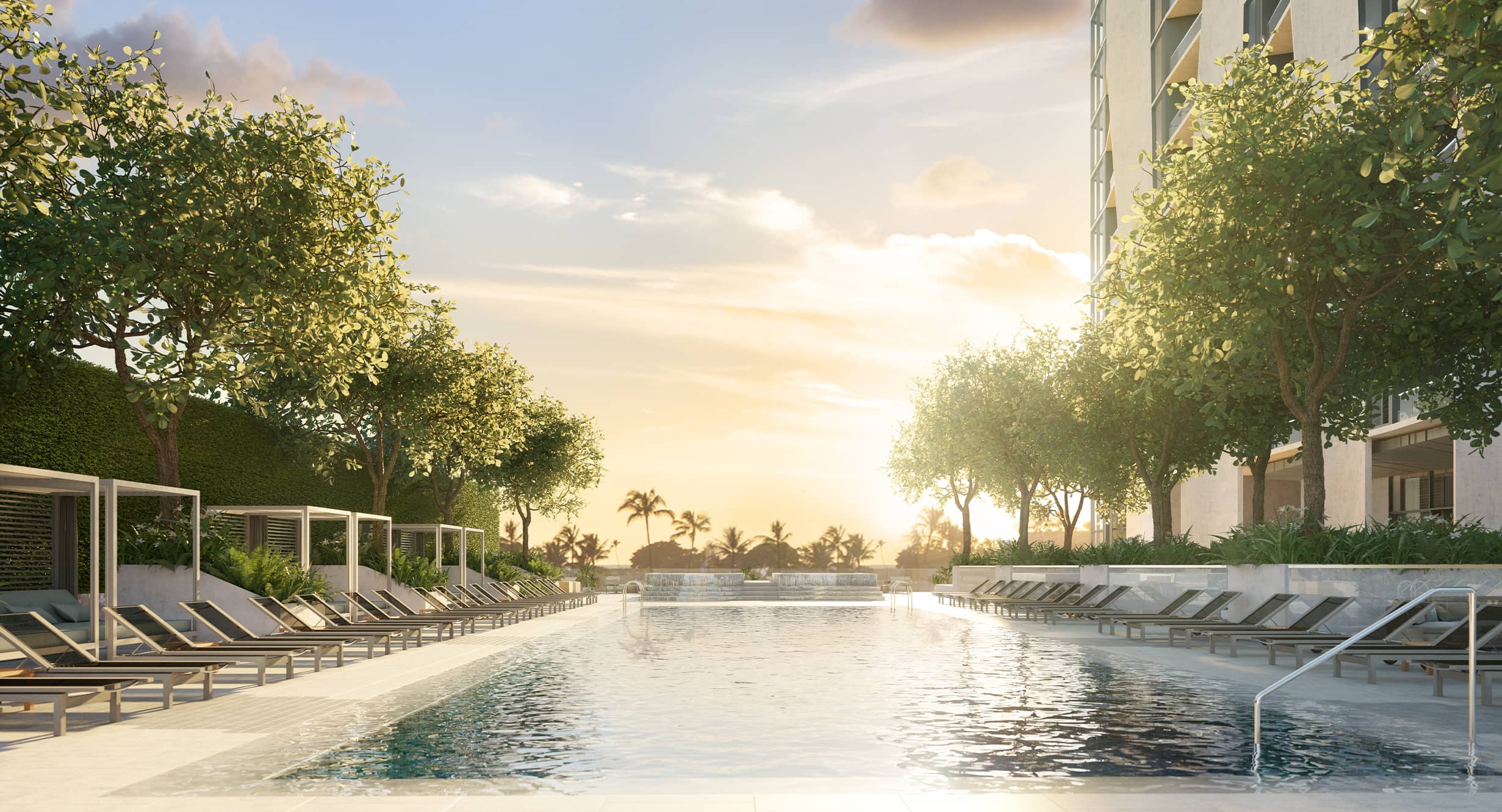 Kōʻula's Pool surrounded by cabanas and lounge chairs